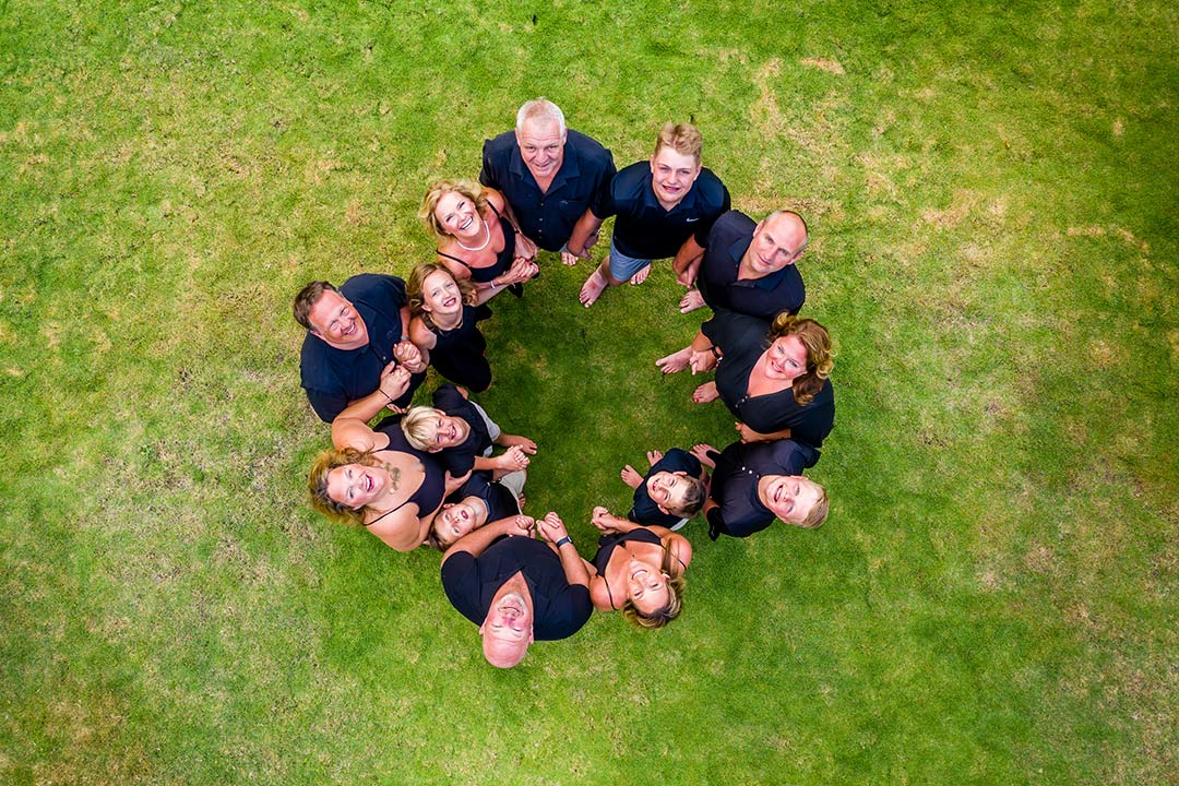 Tamarindo family photoshoot – aerial shot of family circle on lawn