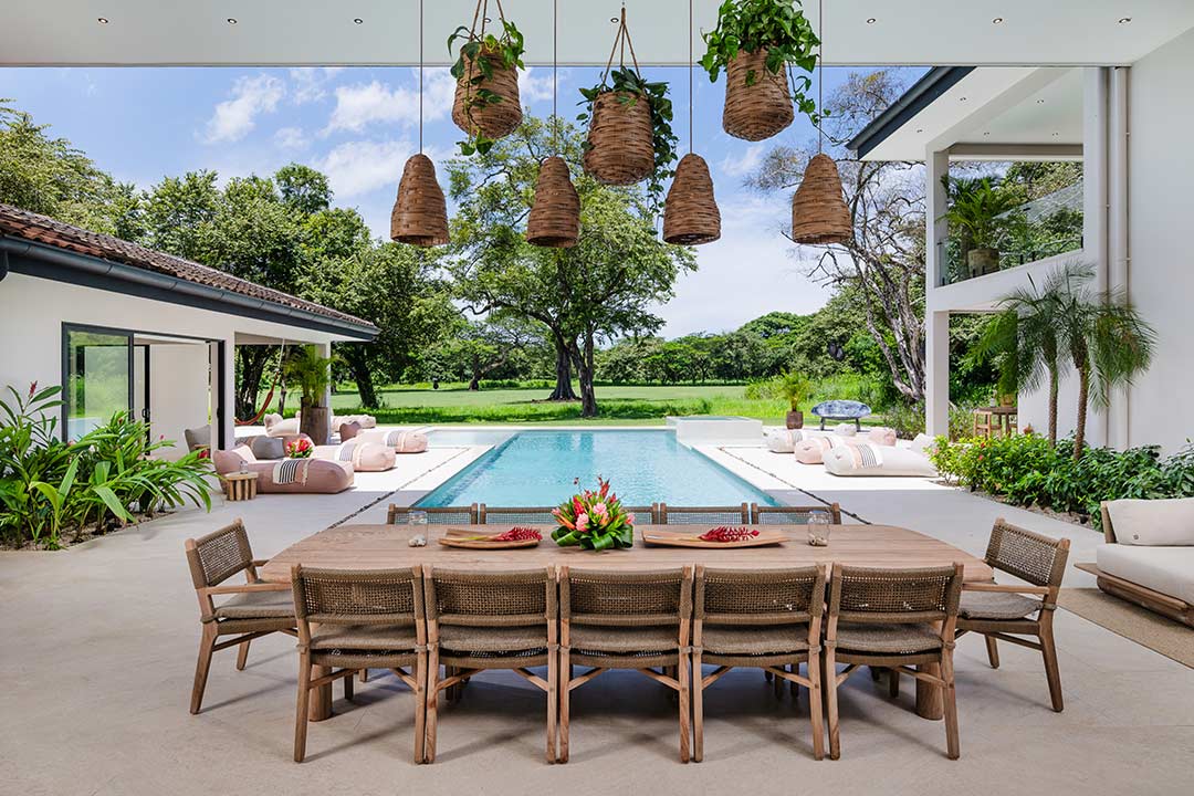 Airbnb photography Costa Rica – tropical dining area with poolside view