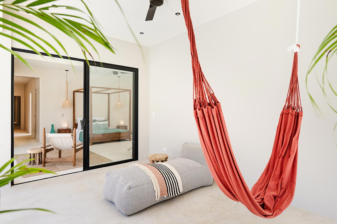 Airbnb lifestyle photography – indoor hammock in bright vacation rental