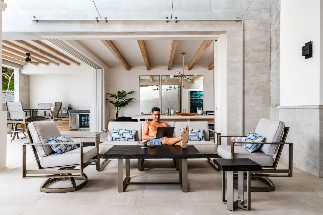 Lifestyle photography Costa Rica – outdoor dining area with rattan furniture and natural textures